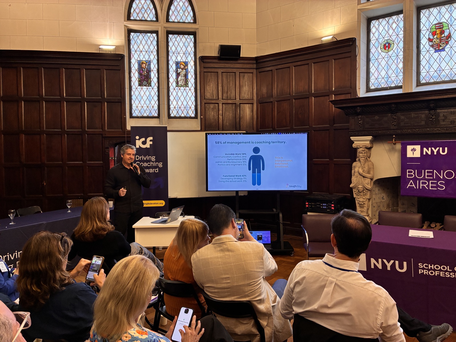 Alberto at NYU Buenos Aires with the Invisible Work data slide behind him